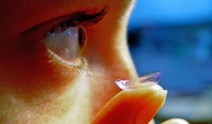 a close shot of a woman's eye and her contact lens