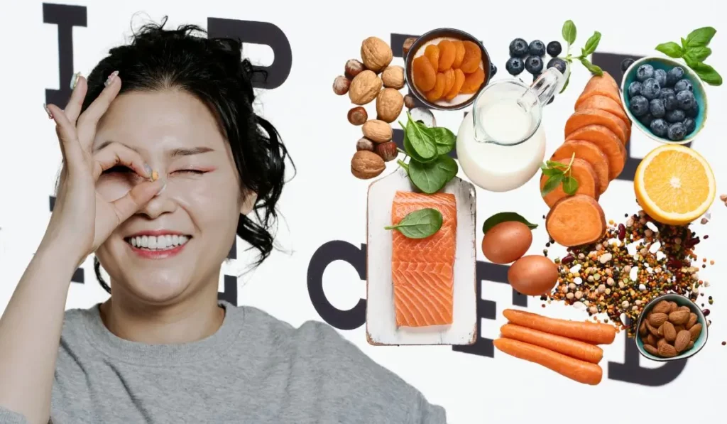 Smiling woman making an eye gesture next to nutrient-rich foods that support eye health, including salmon, carrots, berries, and leafy greens.